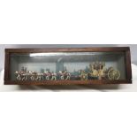 Queen Elizabeth silver jubilee coach and horses in a glazed display case. 62 w x 18cms h.