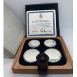 A cased Canadian 1976 Olympic coin proof set in wood and leather box. Condition ReportMint, no