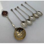 RMS Berengaria sifter spoon with 5 hallmarked silver coffee spoons. Coffee spoons weight. 33.6gms.