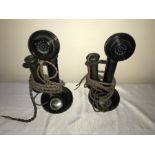 Two early 20thC Bakelite stick telephones . 31cms h. Condition ReportSlight chip to bottom of one.