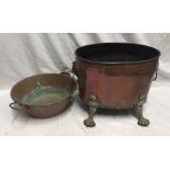 Copper and brass log bucket with lions head handles and paw feet. Oval shaped 42 w x 31 x 33cms h