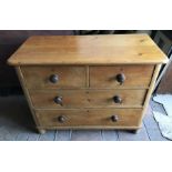 Pine two over two height chest of drawers. wooden knob handles, turned feet. 105 w x 50 d x 82cms h.