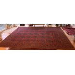 A rectangular deep red wool ground rug. 248W x 338L cm.Condition ReportGood condition.