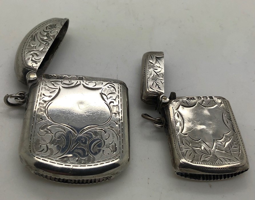 Two hallmarked silver vesta cases, both with vacant cartouche. Birmingham 1910 and Birmingham