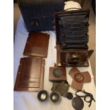 An early 20thC Reynolds and Branson, Leeds mahogany folding plate camera with two lenses and