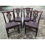 Four Georgian Oak splat back dining chairs, (three plus one) square legs, brown leather seating,