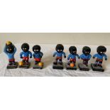 A group of 7 Robertson Golly footballers, 3 x 'hand painted foreign', 4 x plastic. Condition