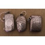 Three hallmarked silver vesta cases, foliage engraved, two with clear cartouche, one initialled S.M.