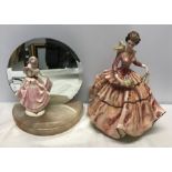 Small Royal Doulton figurine, 17.5cms h stood on a half round onyx base with circular mirror back,