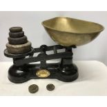 Cast iron Salter weighing scales with brass pan and iron weights. Condition ReportGood condition.