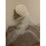 A vintage bridal headdress with veil in original box from Kendals, Manchester. Condition