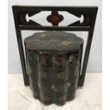 Chinese decorative lacquer four section rice box with carry handle. 42 h x 31cms w. Condition