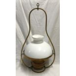 Brass hanging oil lamp with milk glass shade. 64 h x 34 cms w.Condition ReportNo glass chimney