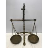 Set of tall brass balance scales, maker Doyle and Son, London. 56cms h. Condition