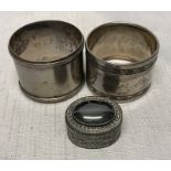 Continental silver, two napkin rings 800 silver and a decorative pill pox stamped 900.Condition