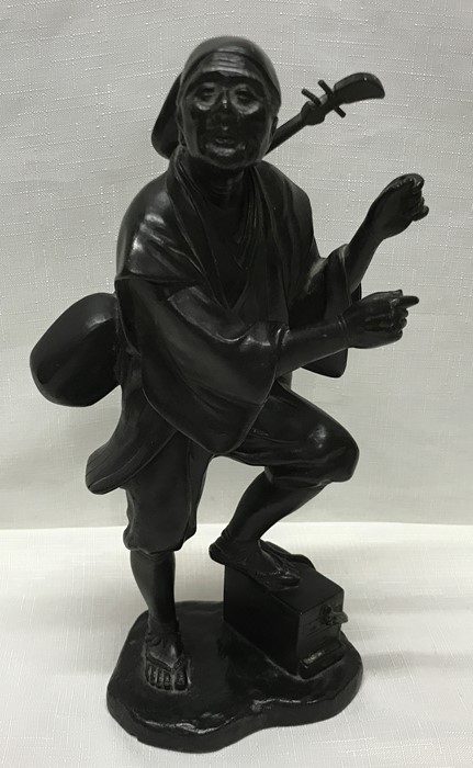 Japanese Meiji period bronze figure of a musician carrying a Shamisen with signature to the base.