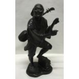 Japanese Meiji period bronze figure of a musician carrying a Shamisen with signature to the base.