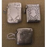 Three hallmarked silver vesta cases, foliage engraved with clear cartouche, RB's Birmingham 1919,