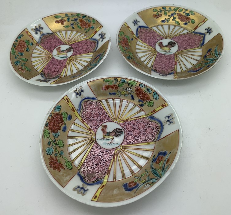 Three 18thC Chinese porcelain saucers with cockerel and 3 fans decoration, Zheng or Qianlong period.