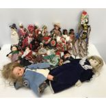 Collection of International dress dolls, a puppet doll and glove puppet, a plastic Famosa doll and a
