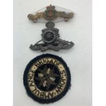 Three badges to include WW1 Royal Artillery, WW1 Canadian Sub Mariner and St John's Ambulance