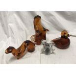 Four Wedgwood glass animal paperweights, three amber, largest 16cms h, one clear 7cms h. Condition