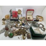 A large quantity of vintage costume jewellery to include 19thC lockets, ''Hollywood'' brooch dress