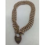 A 9ct gold double chain bracelet with padlock clasp and safety chain. 20.7gms. Condition