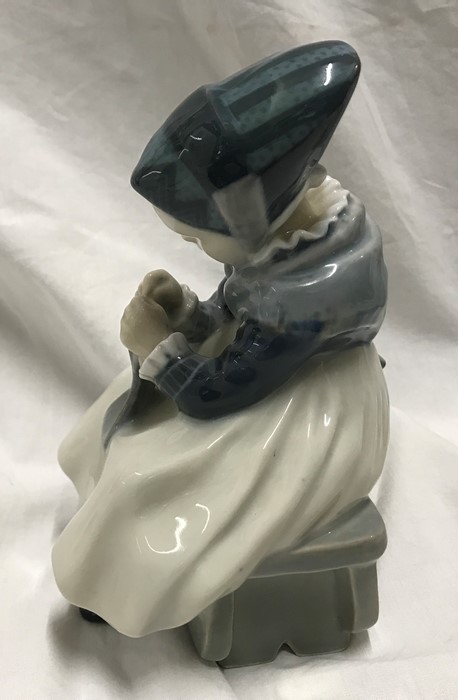 Royal Copenhagen Denmark figurine, Amager girl sewing 16cms h x 11cms w, signed to the base. Model - Image 2 of 5