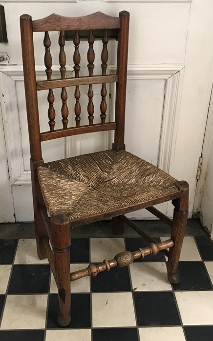 Early 19thC rush seated oak dining chair, turned stretcher on pad feet, height to seat 42cms, height