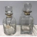 Two silver mounted lead glass decanters. One with silver gin label, Bewlay and Co, Birmingham 2004.