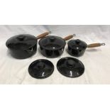 Set of three Le Creuset French cast iron pans, sizes 22, 20 and 14, with two spare lids, size 16 and