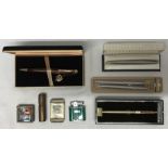 A collection of pens and lighters to include Laque Norton pen with presentation box, gold colour