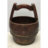 Chinese metal bound wooden bucket with carry handle. 37 h x 32cms w. Condition ReportLoose metal