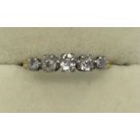 Five stone diamond ring set in yellow metal, marks rubbed, size Q, 2.5gms total.Condition