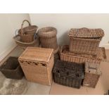 A large quantity of wicker work and baskets to include lidded stool, laundry baskets, table etc (