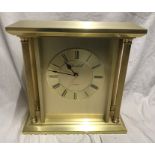 Churchill quartz brass effect mantle clock, Corinthian column sides, working. 22.5 w x 22 h x 9cms