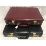 Two combination lock briefcases. Black 44 w x 33 h x 9cms d and Brown 44 w x 32 h x 10cms d.