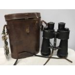 Pair of leather cased binoculars, stamped beh 441097. 7 x 50. Condition ReportFoxing inside lens,