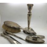 Various hallmarked silver items including candlestick, hairbrush, nail buffers, two silver handled