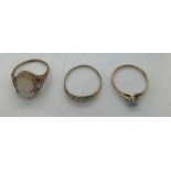 Three 9ct gold dress rings, including shell cameo, single stone (paste) 5.7gms total. Sizes, Cameo