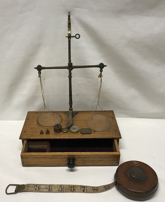 Brass set of balance scales with oak drawer base, label to the back for A Franks Ltd Opticians,