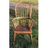 Windsor stick back armchair, height to seat 44cms, height to back 112cms, width of arms 59cms.