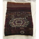 Hand woven patterned rug, 92cms l x 74cms w. Condition ReportGood condition.