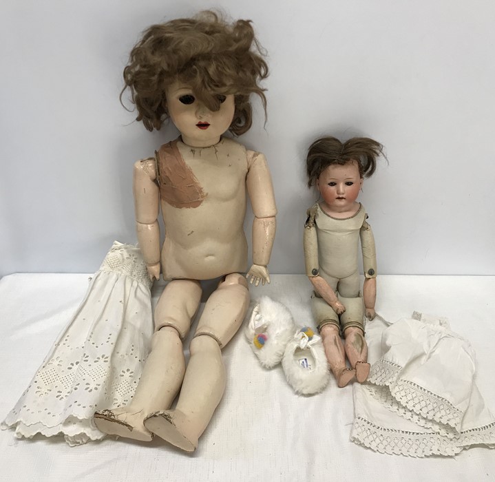 Two early 20thC dolls, Heubach 275 pot headed doll with leather body, 42cms h and a large Unica