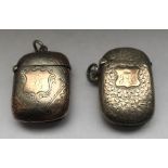 Two hallmarked silver and gold mounted vesta cases, engraved foliage decoration, gold cartouche. 4.