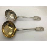 Two Russian silver fiddle pattern ladles marked 84, one with gilt interior. 69.2gms. Condition