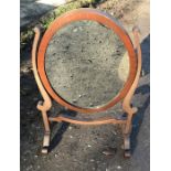 Mahogany oval framed toilet mirror. 59 h x 39cms w, mirror size 27 w x 36cms h. Condition ReportGood