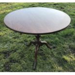 A 19thC mahogany circular tip top table, tripod pedestal base with pad feet, 92cms w, 75cms h.