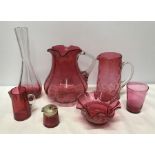 Cranberry glassware selection, three jugs 20cms, 16cms and 10cms, tall vase 26cms h, small bowl